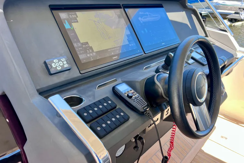 Slide: The Image of Helm of 2022 Windy SR 44 BLACKHAWK with advanced navigation displays and controls. - 45