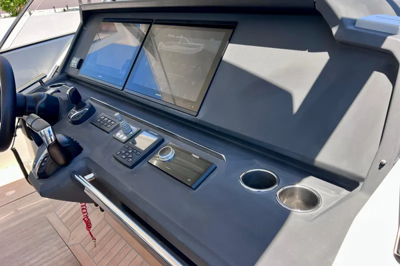 Slide: The Image of Control panel of 2022 Windy SR 44 BLACKHAWK boat with dual screens and controls. - 46