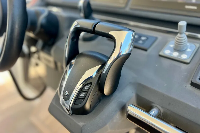 Slide: The Image of Close-up of 2022 Windy SR 44 BLACKHAWK boat throttle controls. - 49