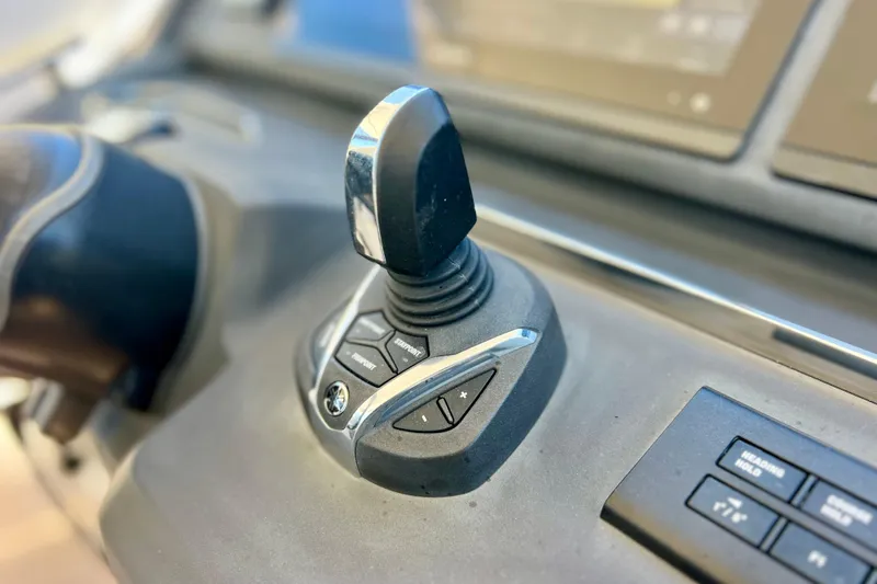 Slide: The Image of Close-up of 2022 Windy SR 44 BLACKHAWK joystick control on the dashboard. - 50