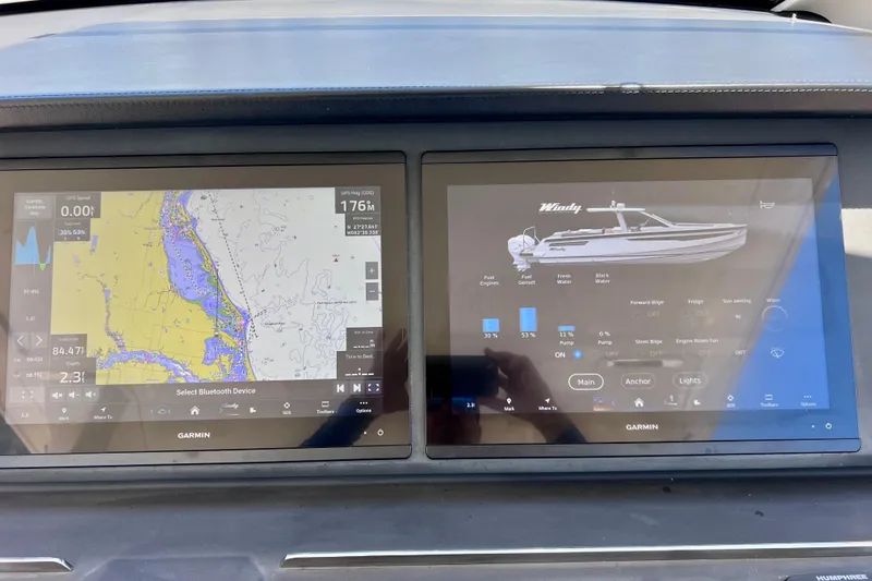 Slide: The Image of Dashboard of 2022 Windy SR 44 BLACKHAWK with navigation and system controls displayed. - 52