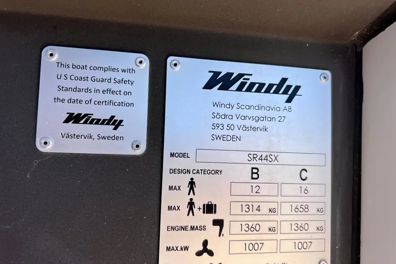 Slide: The Image of Plaques on Windy SR 44 BLACKHAWK, 2022, showing compliance with US Coast Guard standards. - 59