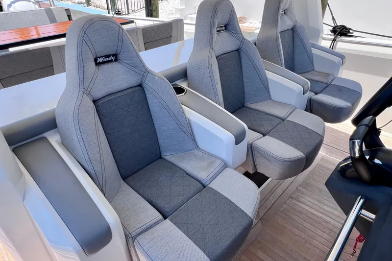Slide: The Image of Luxury seating on 2022 Windy SR 44 BLACKHAWK boat, featuring elegant gray upholstery. - 60