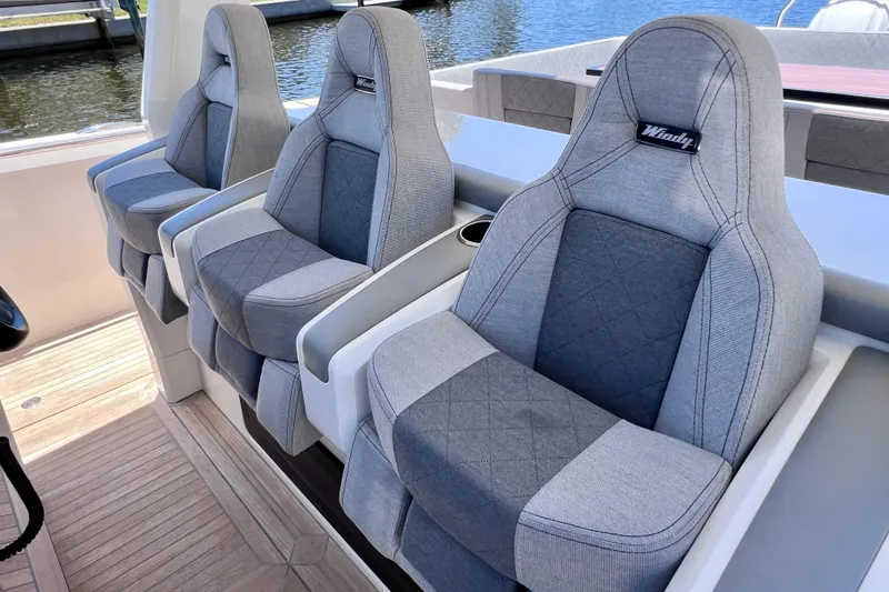 Slide: The Image of Luxury seating on 2022 Windy SR 44 BLACKHAWK boat, featuring elegant gray upholstery. - 61