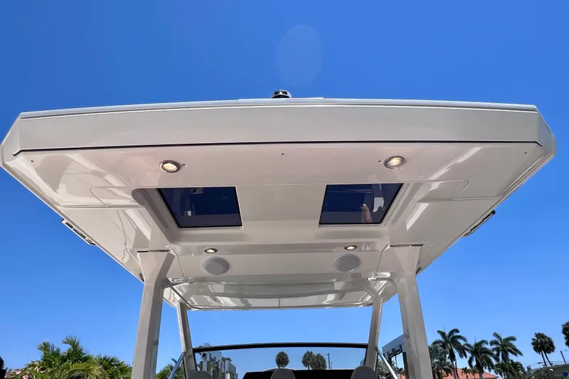 Slide: The Image of 2022 Windy SR 44 BLACKHAWK boat canopy against clear blue sky. - 63