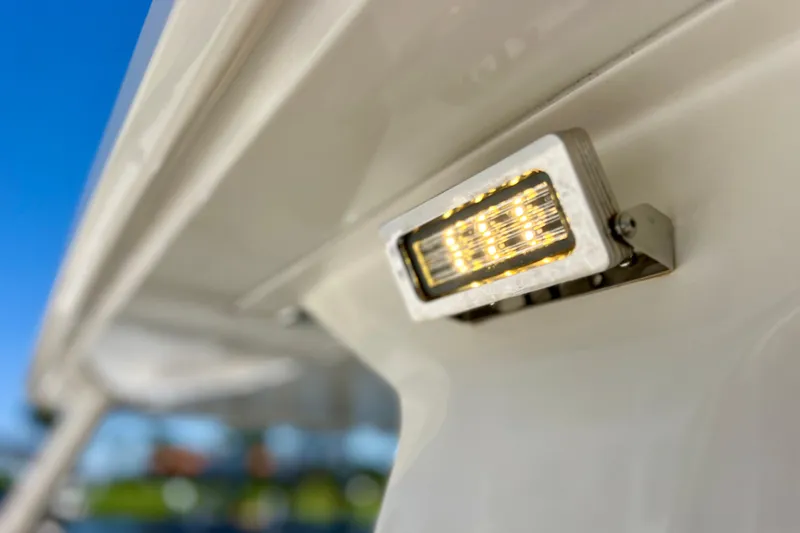 Slide: The Image of Close-up of LED light on 2022 Windy SR 44 BLACKHAWK boat against blue sky. - 64