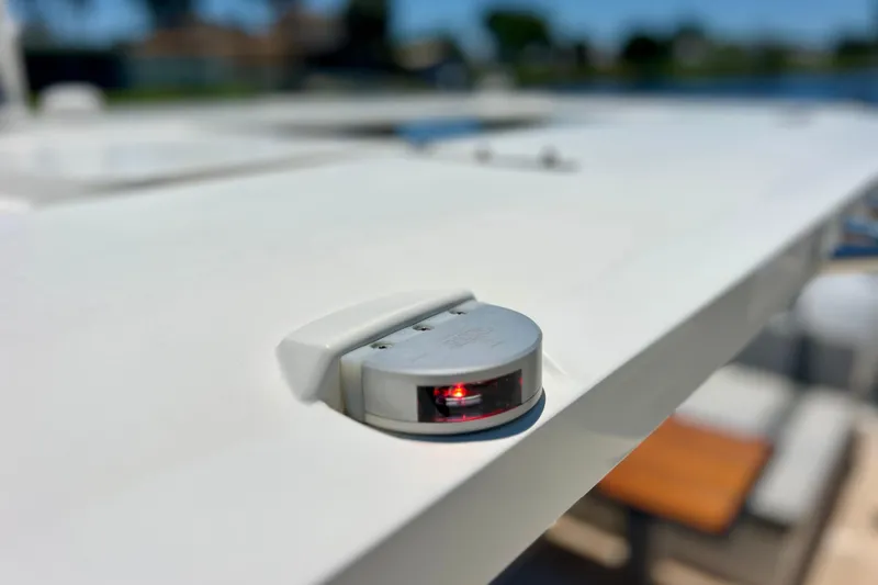 Slide: The Image of Close-up of navigation light on 2022 Windy SR 44 BLACKHAWK yacht deck. - 67