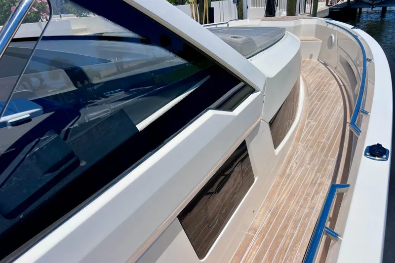 Slide: The Image of 2022 Windy SR 44 BLACKHAWK yacht with sleek design and wooden deck details. - 68