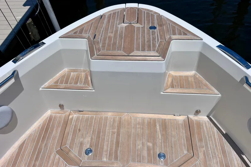 Slide: The Image of 2022 Windy SR 44 BLACKHAWK boat deck with elegant wood finish and seating area. - 72