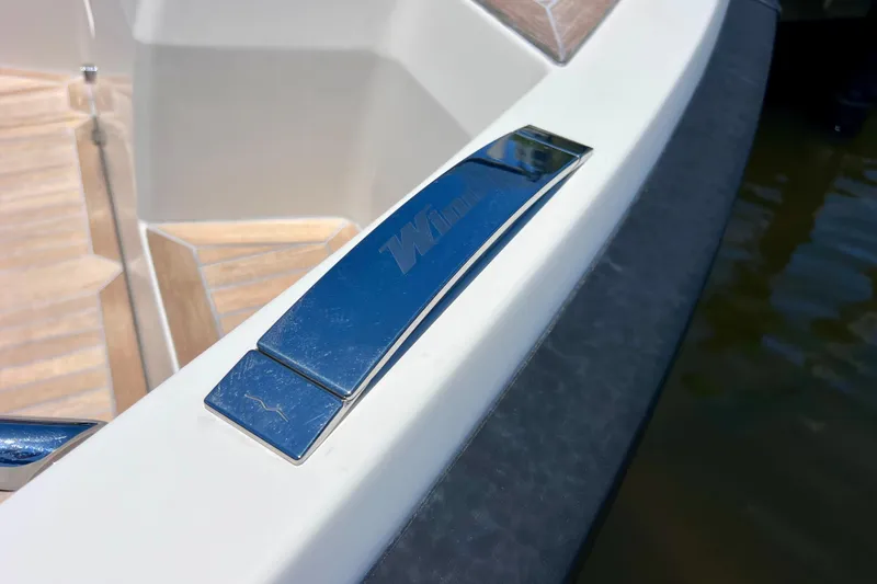 Slide: The Image of Close-up of 2022 Windy SR 44 BLACKHAWK boat detail with chrome accents. - 76