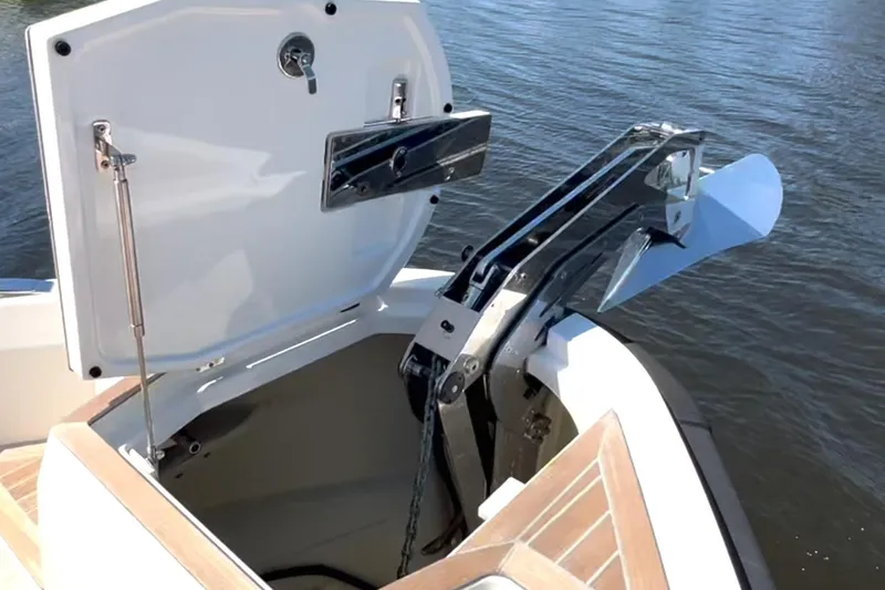 Slide: The Image of Anchor compartment of 2022 Windy SR 44 BLACKHAWK yacht, open with visible anchor mechanism. - 79