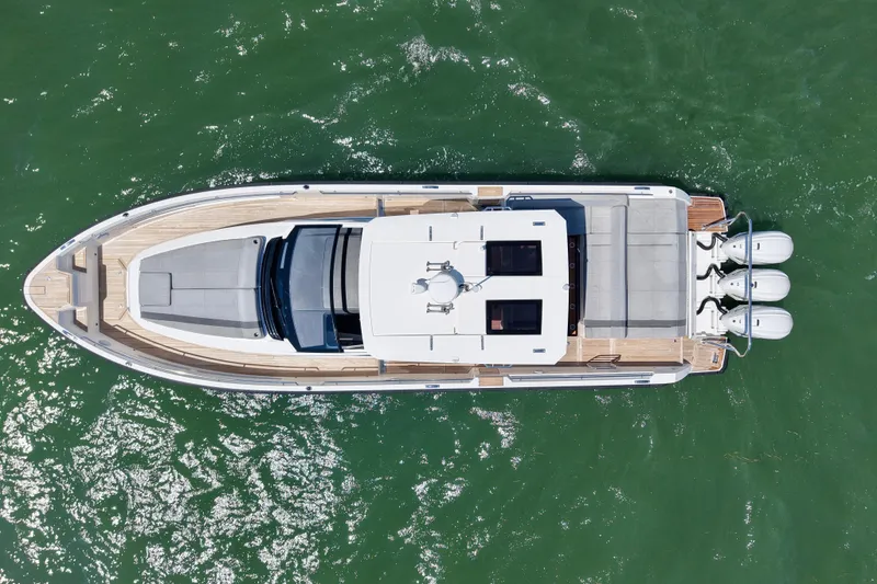 Slide: The Image of Aerial view of 2022 Windy SR 44 BLACKHAWK luxury yacht on green water. - 8