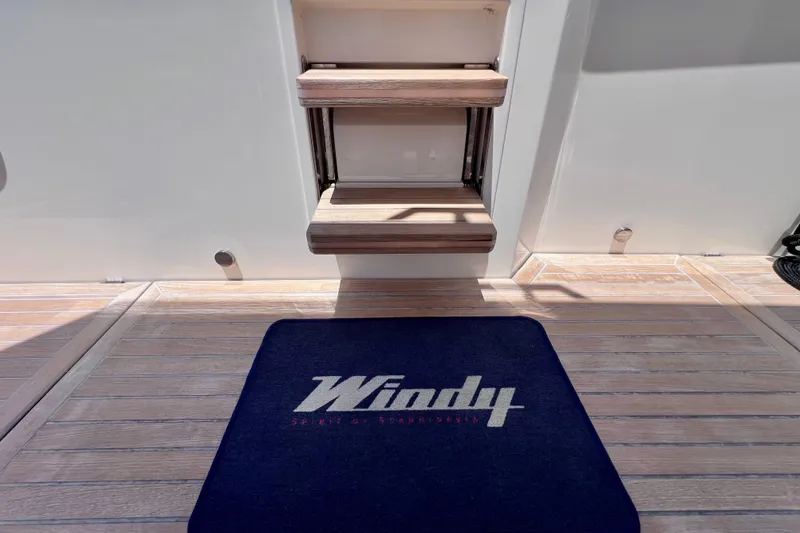 Slide: The Image of 2022 Windy SR 44 BLACKHAWK yacht deck with branded mat and wooden steps. - 84