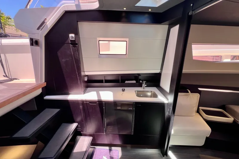 Slide: The Image of Luxurious interior of 2022 Windy SR 44 BLACKHAWK yacht with modern kitchen design. - 86