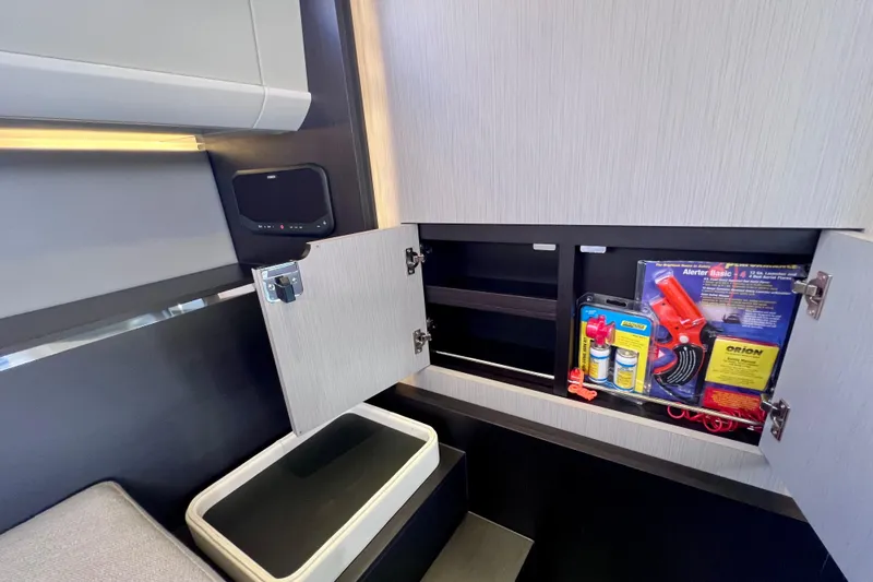 Slide: The Image of Interior storage of 2022 Windy SR 44 BLACKHAWK yacht with safety equipment. - 94