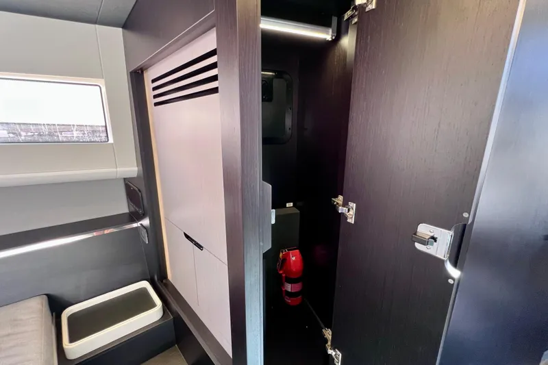 Slide: The Image of Interior of 2022 Windy SR 44 BLACKHAWK yacht with open storage compartment. - 96