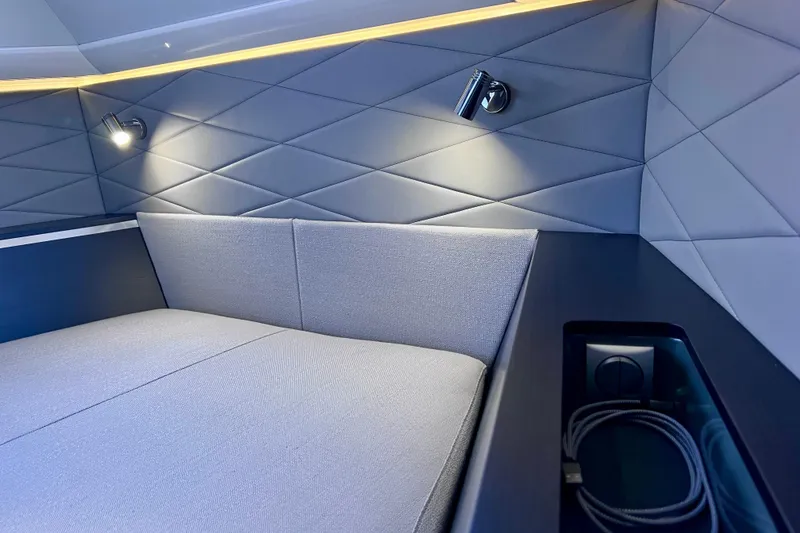 Slide: The Image of Luxurious interior cabin of 2022 Windy SR 44 BLACKHAWK yacht with modern lighting and quilted walls. - 99