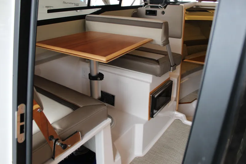 Slide: The Image of 2024 Cutwater C-248 Coupe interior with dining area and seating. - 15