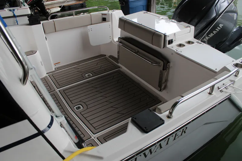 Slide: The Image of 2024 Cutwater C-248 Coupe boat deck with seating and Yamaha engine. - 25