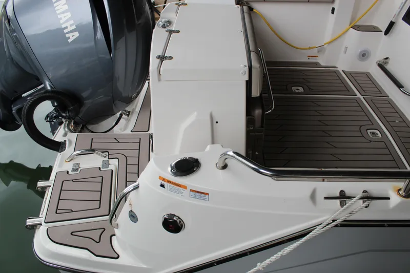 Slide: The Image of 2024 Cutwater C-248 Coupe boat deck with Yamaha engine, featuring sleek design and modern fittings. - 30