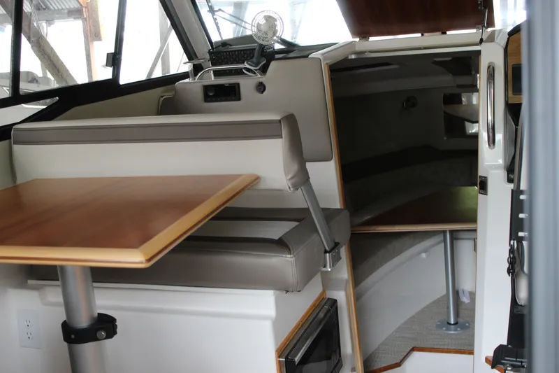 Slide: The Image of Interior of 2024 Cutwater C-248 Coupe, featuring seating and a compact cabin space. - 6