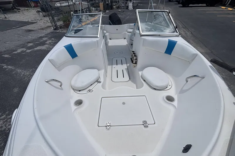 Slide: The Image of 2002 Wellcraft 180 Sportsman boat interior with seating and storage compartments. - 11
