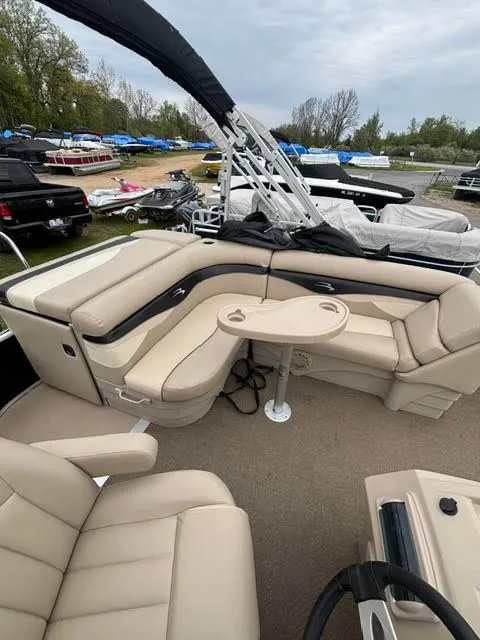 Slide: The Image of Interior of a 2013 Bennington 20SLMX pontoon boat with beige seating. - 10