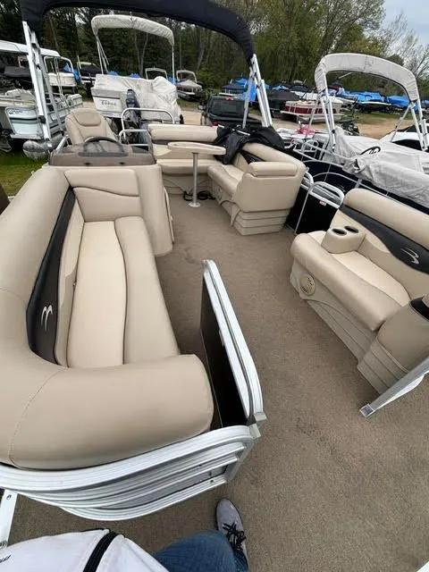 Slide: The Image of Interior of a 2013 Bennington 20SLMX pontoon boat with beige seating. - 9