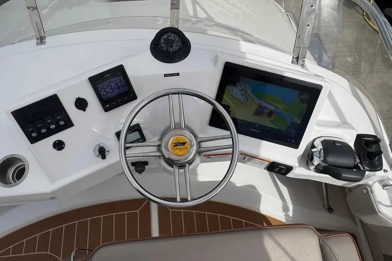 Slide: The Image of 2020 Cutwater C-30 CB helm with navigation display and controls. - 17