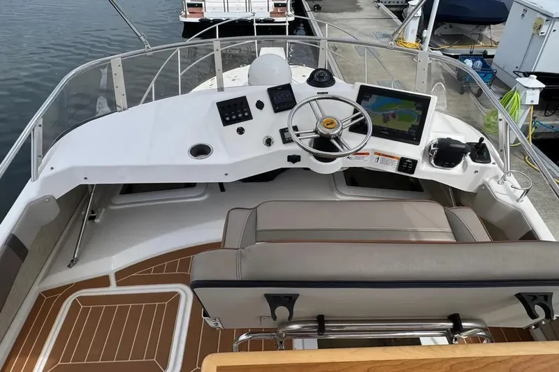 Slide: The Image of 2020 Cutwater C-30 CB boat helm with modern navigation equipment and comfortable seating. - 18