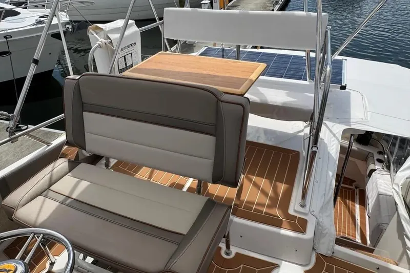Slide: The Image of 2020 Cutwater C-30 CB boat interior with seating and wooden table on deck. - 5