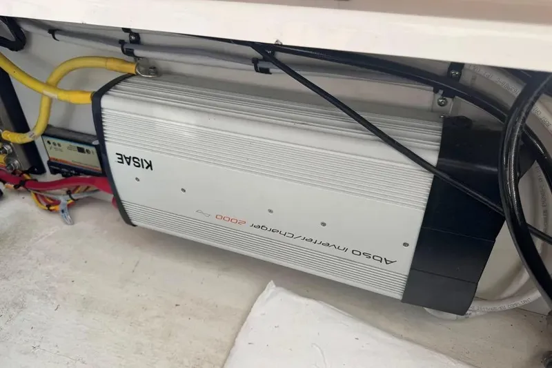 Slide: The Image of Inverter charger in a 2020 Cutwater C-30 CB boat, featuring cables and connections. - 7