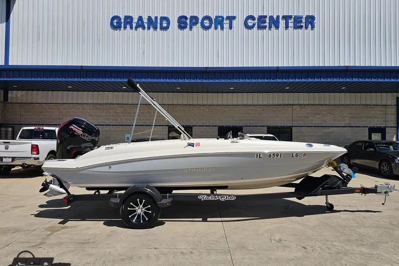 The Image of 2023 Stingray 182 SC boat on trailer at Grand Sport Center dealership. - 1