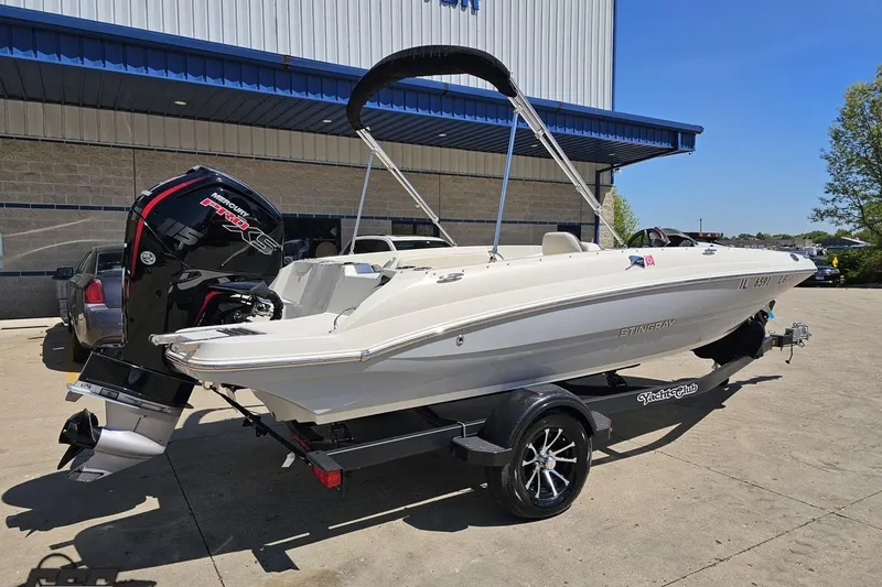 Slide: The Image of 2023 Stingray 182 SC boat with Mercury Pro XS engine on a trailer. - 10