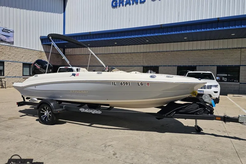 Slide: The Image of 2023 Stingray 182 SC boat on trailer outside a dealership. - 15