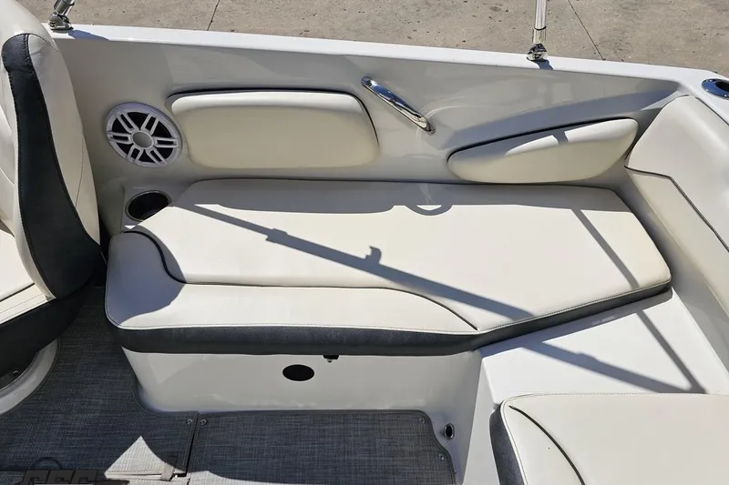Slide: The Image of 2023 Stingray 182 SC boat interior with cushioned seating and speaker. - 41