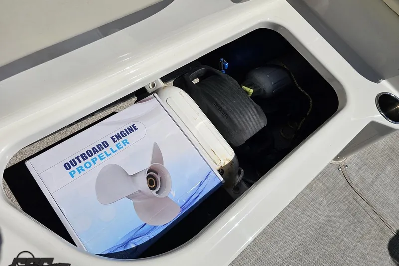 Slide: The Image of Storage compartment of 2023 Stingray 182 SC with outboard engine propeller box. - 44