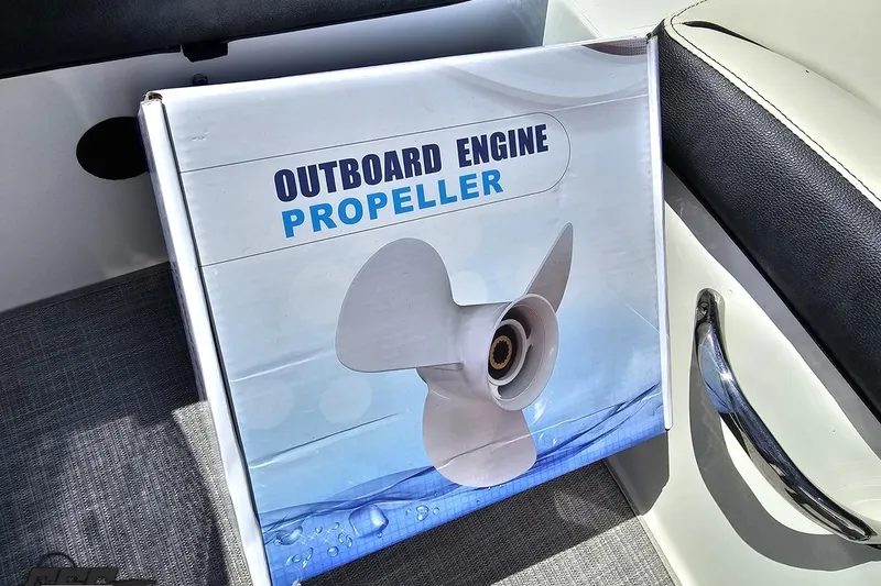 Slide: The Image of Box of outboard engine propeller on 2023 Stingray 182 SC boat seat. - 46