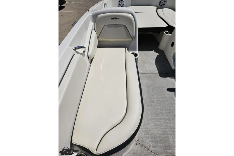 Slide: The Image of 2023 Stingray 182 SC boat interior with cushioned seating and modern design. - 47