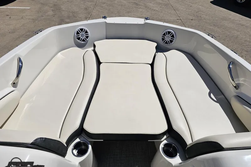 Slide: The Image of 2023 Stingray 182 SC boat interior with cushioned seating and built-in speakers. - 63