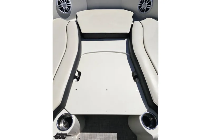 Slide: The Image of 2023 Stingray 182 SC boat interior with cushioned seating and built-in speakers. - 66