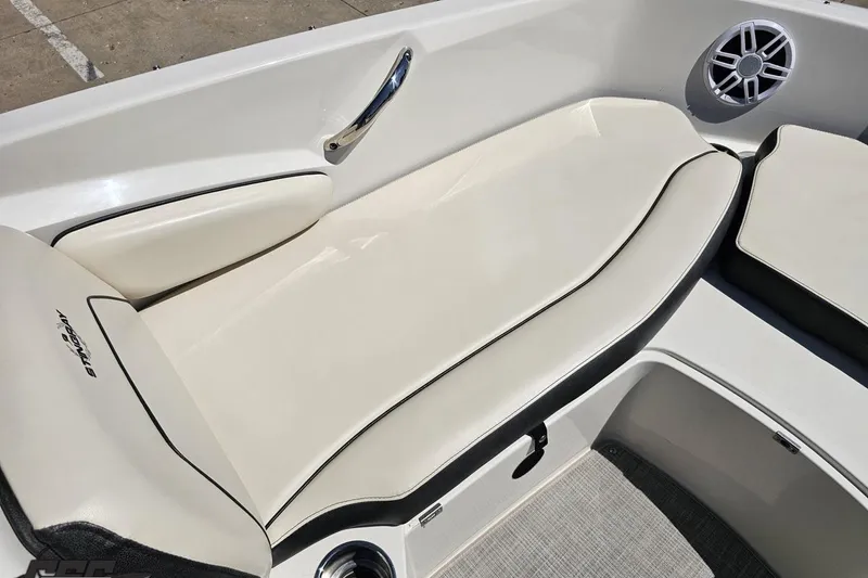 Slide: The Image of 2023 Stingray 182 SC boat interior with cushioned seating and speaker. - 71
