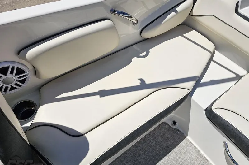 Slide: The Image of 2023 Stingray 182 SC boat interior with cushioned seating and speaker. - 79