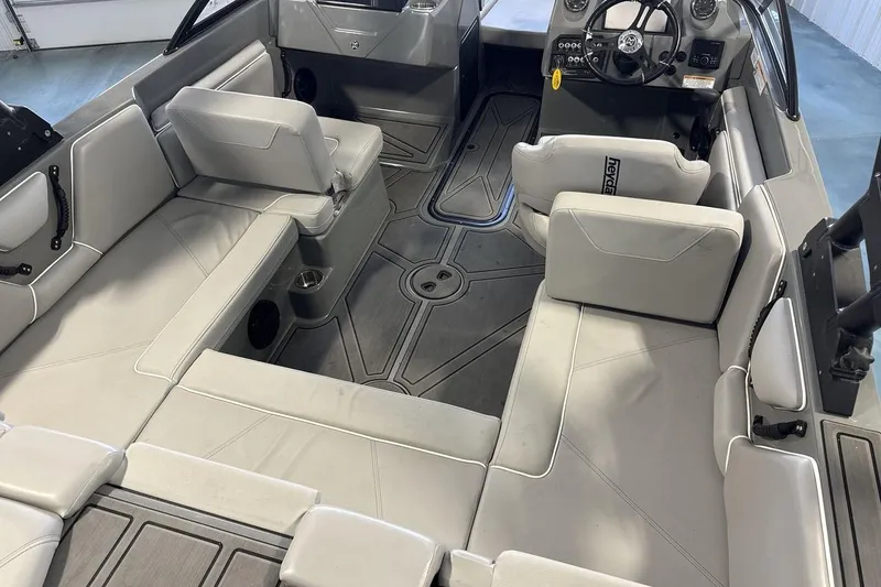 Slide: The Image of 2024 Heyday WTSurf boat interior with spacious seating and modern dashboard design. - 10