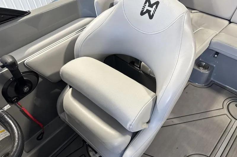 Slide: The Image of 2024 Heyday WTSurf boat interior with ergonomic captain's seat and control panel. - 13