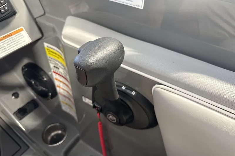Slide: The Image of 2024 Heyday WTSurf boat throttle control with gear shift lever and safety warnings. - 16