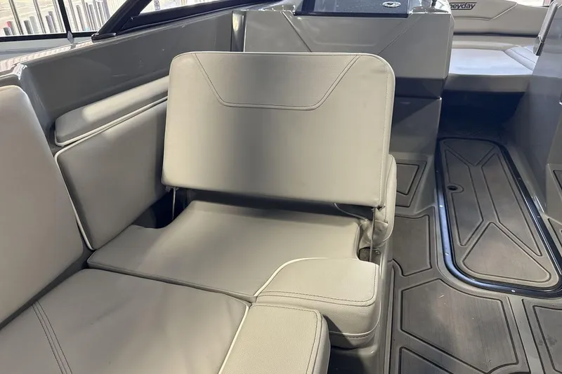 Slide: The Image of 2024 Heyday WTSurf boat interior with gray seating and sleek design. - 23