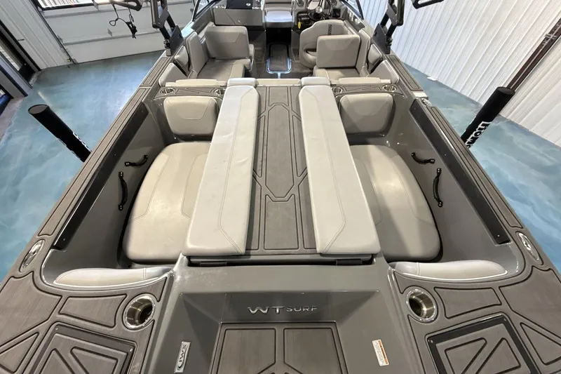 Slide: The Image of 2024 Heyday WTSurf boat interior with gray seating and modern design. - 9