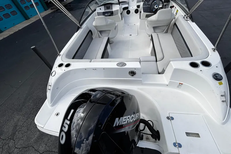 Slide: The Image of 2022 Hurricane SunDeck 217 OB boat interior with Mercury engine, featuring spacious seating and modern design. - 10