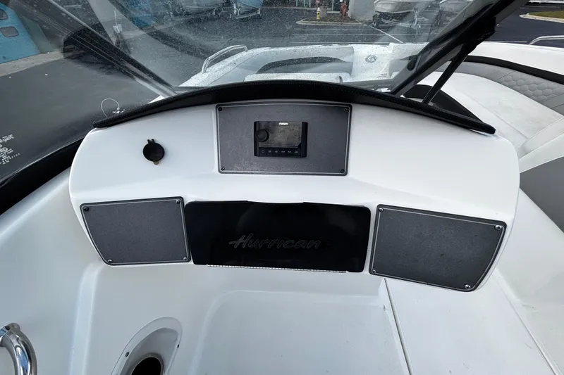 Slide: The Image of 2022 Hurricane SunDeck 217 OB dashboard with control panel and speakers. - 5